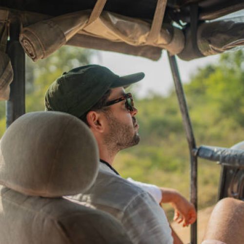 Young man in jeep on safari, Yala National Park