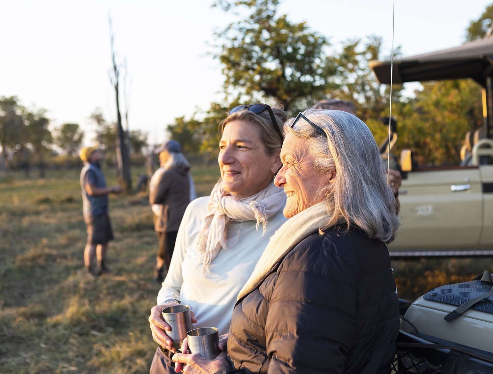 senior woman and adult daughter on safari, Okavango Delta, Botswana